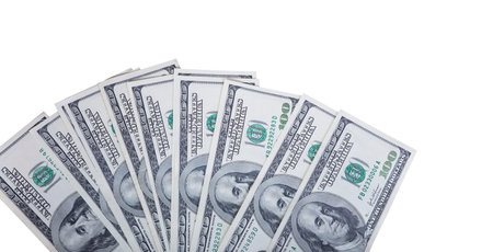 One hundred dollar bills, on a white background. Finance and business concept