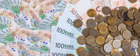 Euro banknotes and iron 10 rubles coin (written ten rubles, Bank of Russia in the Russian). Finance...
