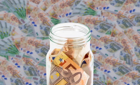 EURO bills in a glass jar. Finance and business conceptの写真素材