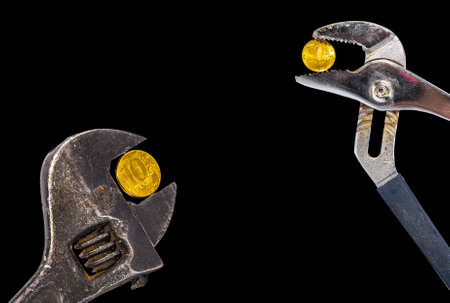 Allegory of the global financial crisis - Iron 10 rubles coin (written ten rubles, Bank of Russia in the Russian) in the grip of economic crisis, on a black background. Finance and business conceptの写真素材