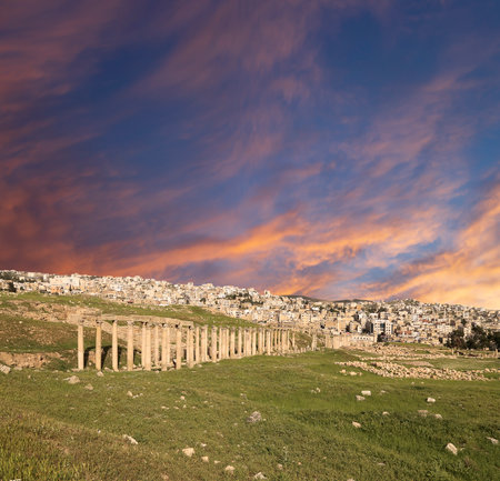 Roman ruins (against the background of a beautiful sky with clouds) in the Jordanian city of Jerash (Gerasa of Antiquity), capital and largest city of Jerash Governorate, Jordanの写真素材