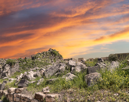 Roman ruins at Umm Qais (Umm Qays)--is a town in northern Jordan near the site of the ancient town of Gadara, Jordan. Against the background of a beautiful sky with cloudsの写真素材