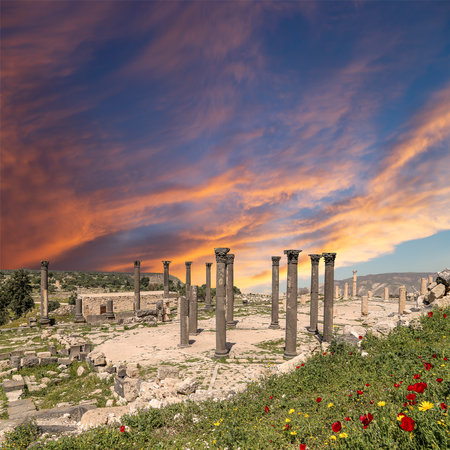 Roman ruins at Umm Qais (Umm Qays)--is a town in northern Jordan near the site of the ancient town of Gadara, Jordan. Against the background of a beautiful sky with cloudsの写真素材