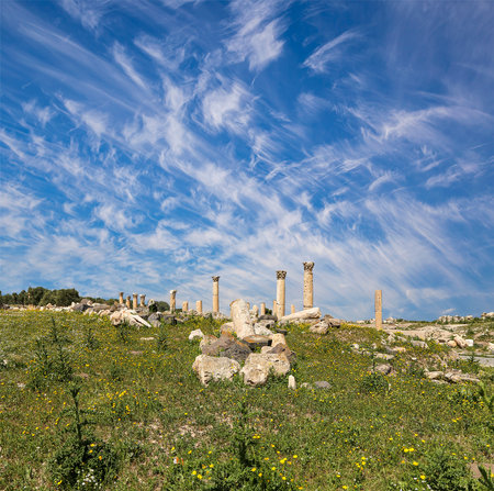 Roman ruins at Umm Qais (Umm Qays)--is a town in northern Jordan near the site of the ancient town of Gadara, Jordan. Against the background of a beautiful sky with cloudsの写真素材
