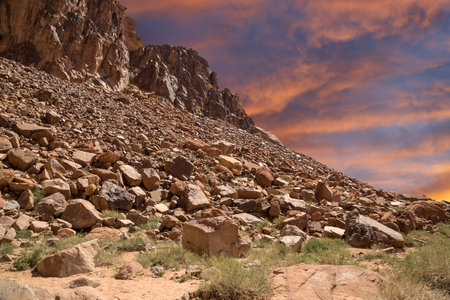 Mountains of Wadi Rum Desert also known as The Valley of the Moon is a valley cut into the sandstone and granite rock in southern Jordan 60 km to the east of Aqabaの写真素材
