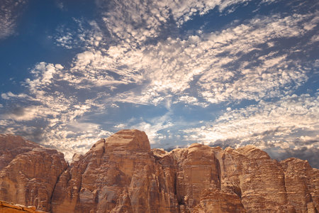 Mountains of Wadi Rum Desert also known as The Valley of the Moon is a valley cut into the sandstone and granite rock in southern Jordan 60 km to the east of Aqabaの写真素材