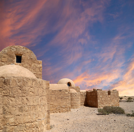 Quseir (Qasr) Amra desert castle (against the sky with clouds) near Amman, Jordan. Built in 8th century, of early Islamic art and architectureの写真素材