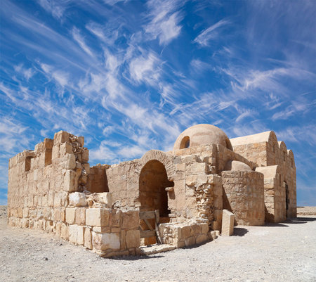 Quseir (Qasr) Amra desert castle (against the sky with clouds) near Amman, Jordan. World heritage...