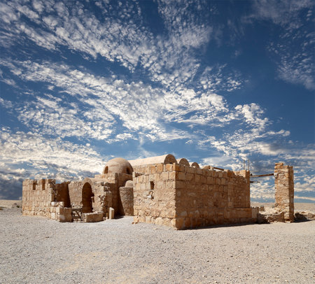 Quseir (Qasr) Amra desert castle (against the sky with clouds) near Amman, Jordan. World heritage with famous fresco's. Built in 8th century, of early Islamic art and architectureの写真素材