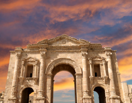Arch of Hadrian in Gerasa (Jerash)-- was built to honor the visit of emperor Hadrian to Jerash in 129/130 AD, Jordan. Against the background of a beautiful sky with cloudsの写真素材