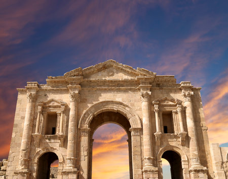 Arch of Hadrian in Gerasa (Jerash)-- was built to honor the visit of emperor Hadrian to Jerash in 129/130 AD, Jordan. Against the background of a beautiful sky with cloudsの写真素材
