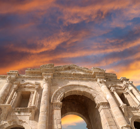 Arch of Hadrian in Gerasa (Jerash)-- was built to honor the visit of emperor Hadrian to Jerash in 129/130 AD, Jordan. Against the background of a beautiful sky with cloudsの写真素材