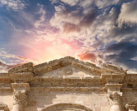 Arch of Hadrian in Gerasa (Jerash)-- was built to honor the visit of emperor Hadrian to Jerash in 129/130 AD, Jordan. Against the background of a beautiful sky with cloudsの写真素材