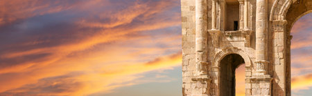 Arch of Hadrian in Gerasa (Jerash)-- was built to honor the visit of emperor Hadrian to Jerash in 129/130 AD, Jordan. Against the background of a beautiful sky with cloudsの写真素材