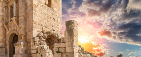 Arch of Hadrian in Gerasa (Jerash)-- was built to honor the visit of emperor Hadrian to Jerash in 129/130 AD, Jordan. Against the background of a beautiful sky with cloudsの写真素材
