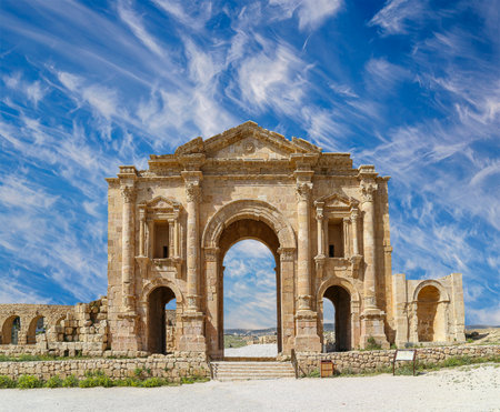 Arch of Hadrian in Gerasa (Jerash)-- was built to honor the visit of emperor Hadrian to Jerash in 129/130 AD, Jordan. Against the background of a beautiful sky with cloudsの写真素材