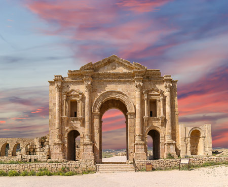 Arch of Hadrian in Gerasa (Jerash)-- was built to honor the visit of emperor Hadrian to Jerash in 129/130 AD, Jordan. Against the background of a beautiful sky with cloudsの写真素材