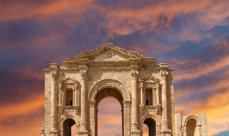Arch of Hadrian in Gerasa (Jerash)-- was built to honor the visit of emperor Hadrian to Jerash in 129/130 AD, Jordan. Against the background of a beautiful sky with cloudsの写真素材