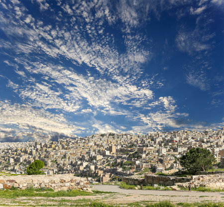 Amman city landmarks-- old roman Citadel Hill, Jordan. Against the background of a beautiful sky with cloudsの写真素材