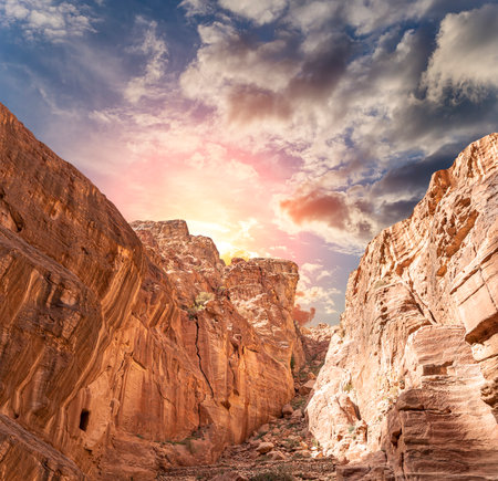 Mountains of Petra (against the background of a beautiful sky with clouds), Jordan, Middle East. Petra has been a UNESCO World Heritage Site since 1985の写真素材