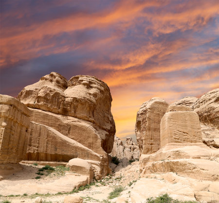 Mountains of Petra (against the background of a beautiful sky with clouds), Jordan, Middle East. Petra has been a UNESCO World Heritage Site since 1985の写真素材
