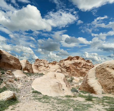 Mountains of Petra (against the background of a beautiful sky with clouds), Jordan, Middle East. Petra has been a UNESCO World Heritage Site since 1985の写真素材