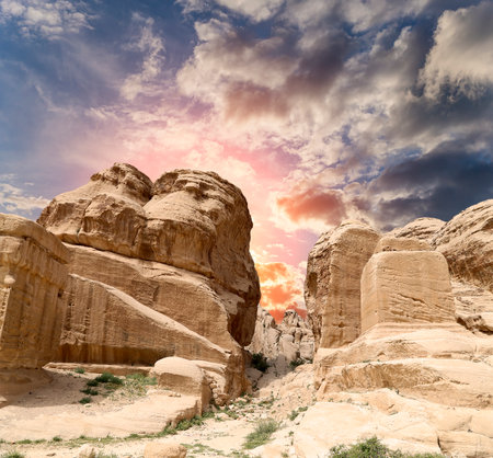 Mountains of Petra (against the background of a beautiful sky with clouds), Jordan, Middle East. Petra has been a UNESCO World Heritage Site since 1985の写真素材