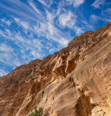 Mountains of Petra (against the background of a beautiful sky with clouds), Jordan, Middle East. Petra has been a UNESCO World Heritage Site since 1985の写真素材