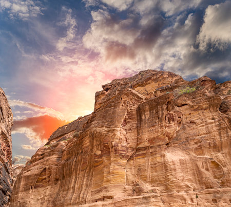Mountains of Petra (against the background of a beautiful sky with clouds), Jordan, Middle East. Petra has been a UNESCO World Heritage Site since 1985の写真素材