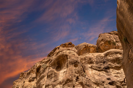 Mountains of Petra (against the background of a beautiful sky with clouds), Jordan, Middle East. Petra has been a UNESCO World Heritage Site since 1985の写真素材