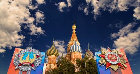Temple of Basil the Blessed with orders of victory in honor of Victory Day celebration (WWII), Red Square, Moscow, Russia. Against the cloudsの写真素材