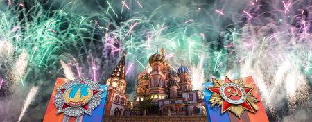 Cathedral of Intercession of Most Holy Theotokos on the Moat (Temple of Basil the Blessed) with orders of victory, and fireworks in honor of Victory Day celebration (WWII), Red Square, Moscow, Russiaの写真素材