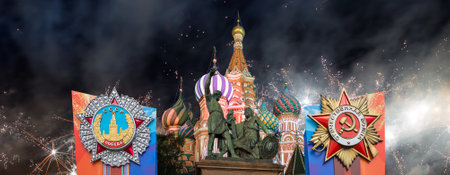 MOSCOW, RUSSIA - MAY, 09 2024: Temple of Basil the Blessed with orders of victory, and fireworks in honor of Victory Day celebration (WWII), Red Squareの写真素材