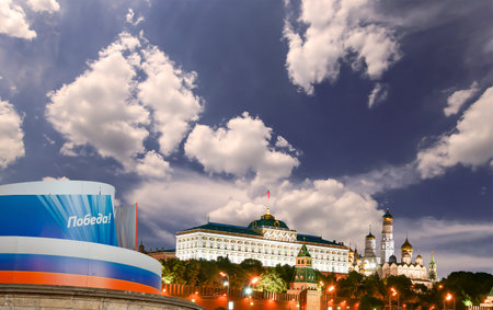 Moscow Kremlin (with decorations for the holiday of May 9 in honor of Victory Day celebration (WWII). Against the sky with clouds, Russia. TRANSLATION: Victory!の写真素材