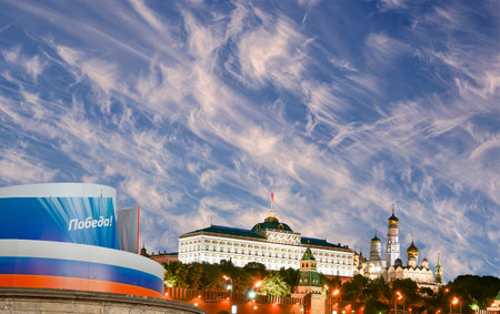 Moscow Kremlin (with decorations for the holiday of May 9 in honor of Victory Day celebration (WWII). Against the sky with clouds, Russia. TRANSLATION: Victory!の写真素材