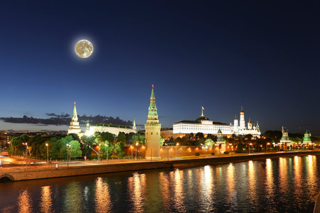 Night view of the Moskva River and Kremlin, Russia, Moscow (most popular view). Against the background of a beautiful sky with clouds, with the moonの写真素材
