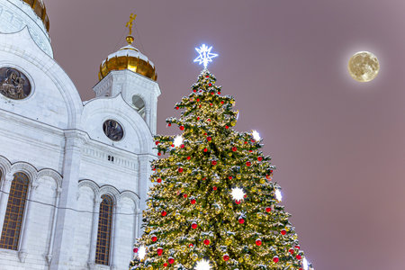 Christmas (New Year holidays) decoration in Moscow (at night with the super moon), Russia--near the Christ the Savior Cathedralの写真素材