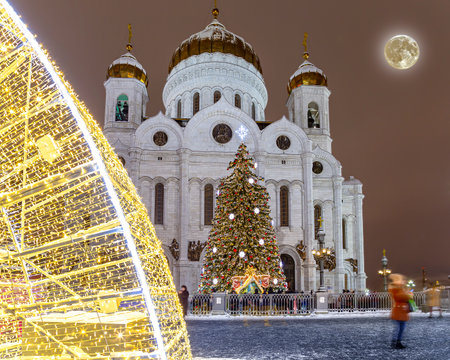 Christmas (New Year holidays) decoration in Moscow (at night with the super moon), Russia--near the Christ the Savior Cathedralの写真素材
