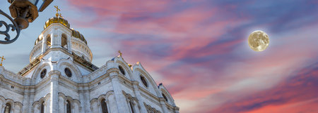 View of the Christ the Savior Cathedral. Against the sunset with the super moon, Moscow, Russiaの写真素材