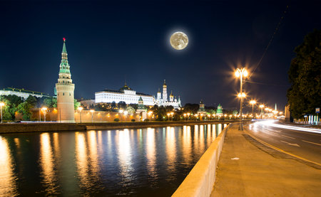 Night view of the Moskva River and Kremlin, Russia, Moscow (most popular view). Against the background of a beautiful sky with clouds, with the moonの写真素材