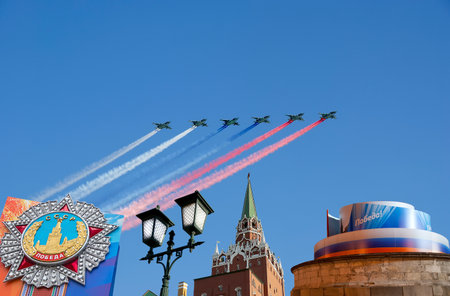 Moscow Kremlin (with decorations of Victory Day celebration (WWII), and Russian military aircraft with painted Russian flag, Russia. TRANSLATION: USSR, Victory!, Patriotic war, May 9の写真素材