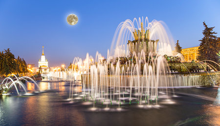 Fountain Stone Flower (with the super moon) at VDNKh in Moscow. VDNKh (called also All-Russian Exhibition Center) is a permanent general-purpose trade show in Moscow, Russiaの写真素材