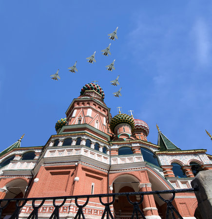 Temple of Basil the Blessed and Russian military aircraft in the sky, Air parade in honor of Victory Day celebration (WWII), Red Square, Moscow, Russiaの写真素材