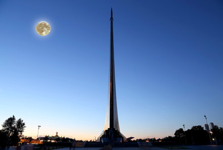 Conquerors of Space Monument (Night view, with the super moon) in the park outdoors of Cosmonautics museum, near VDNK exhibition center, Moscow, Russiaの写真素材