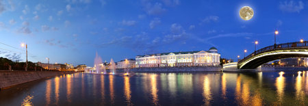 Night view, with the super moon (panorama) on the drain channel near the Luzhkov (Tretyakov) bridge, Moscow, Russiaの写真素材