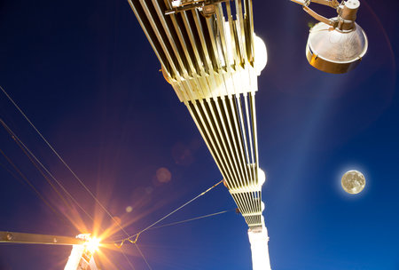 Krymsky Bridge or Crimean Bridge (night, with the super moon) is a steel suspension bridge in Moscow, Russia. The bridge spans the Moskva River 1,800 meters south-west from the Kremlinの写真素材