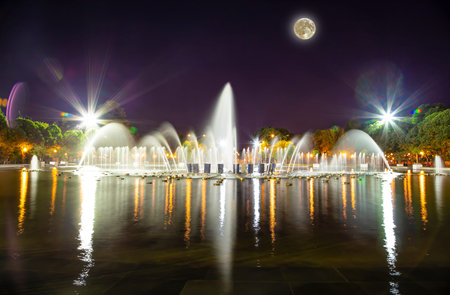 Gorky Park-Central Park of Culture and Rest-- fountain, one of the main citysights and landmark in Moscow, Russia (at night,with the super moon)の写真素材