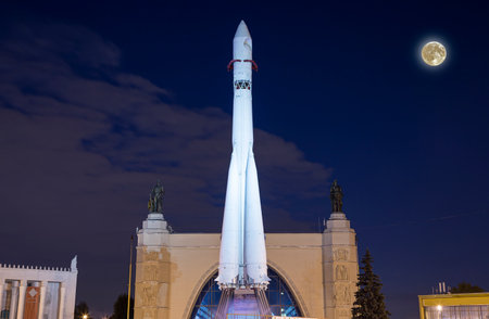 Soviet Space launch vehicle Vostok in VDNKh exhibition (called also All-Russian Exhibition Center) in Moscow, Russia, at night with the super moonの写真素材