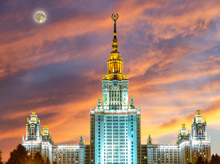 Lomonosov Moscow State University on Sparrow Hills (against the background of a beautiful sunset with the super moon), main building, Russia. It is the highest-ranking Russian educational institutionの写真素材
