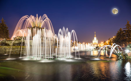 Fountain Stone Flower (at night with the super moon) at VDNKh in Moscow. VDNKh (called also All-Russian Exhibition Center) is a permanent general-purpose trade show in Moscow, Russiaの写真素材